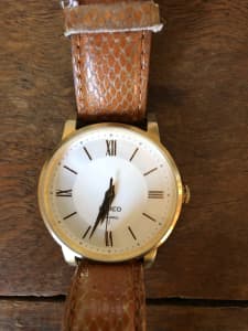 Mimco womans watch gold and leather band