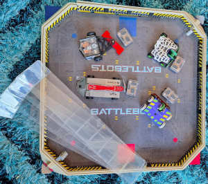 Battle bots play arena.