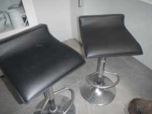 2 bar stools with small back rest, foot rest and chrome legs