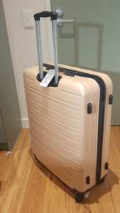 Large pink Hard shell 4 wheel suitcase 