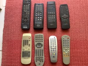 Tv and various remote controls 
