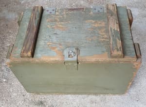 Vintage wooden ammo box with rope handles.
