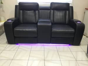Home Theatre Leather Lounge with two seats and Electric Recliner
