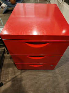 Red pedestrial metal cabinet