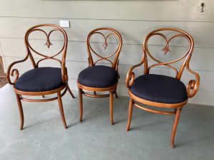 One pair of antique Austrian bent arm chairs with matching single $150