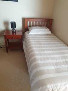 2 Single Timber Beds & new mattresses & cupboards 