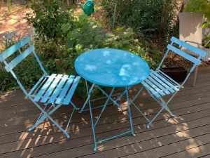 Outdoor round metal table and two matching chairs