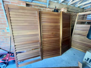 Sliding timber plantation shutters for sliding doors