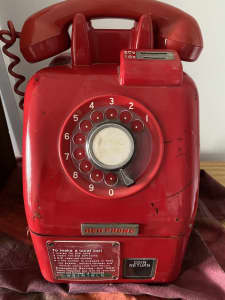 Old vintage red pay phone