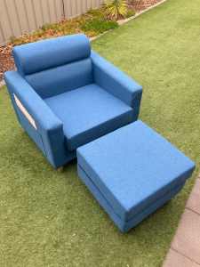 Blue reading chair with matching foot stool