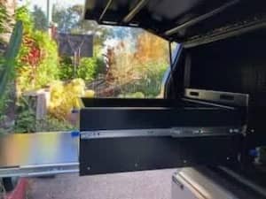 Ute canopy slide out drawer and work bench