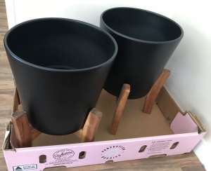 Decorator black ceramic pots with wooden stands. $20 each set NEW