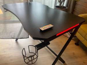 Gaming table with remote LED system, cup holder and silicone cover