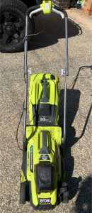 As new Ryobi lawn mower with battery