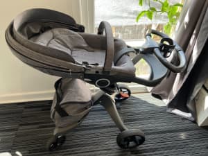 Stokke Pram and Bassinet with baby chair, life jacket, toy and books