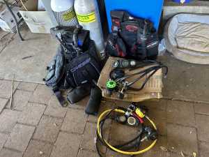 His and hers dive gear with tanks