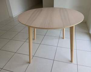 Round dining table, ca. 2 years old. Purchased new from Ikea.
