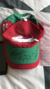 Rabbitohs hat signed by three members