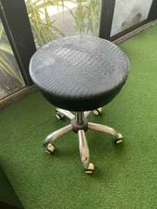 Adjustable rolling stool leather