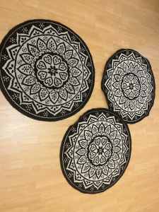 Round black and white matching rugs