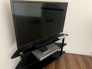 TCL Television, DVD player and TV stand
