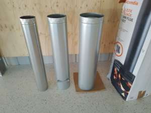 Three lengths of wood heater flue kit, brand new.