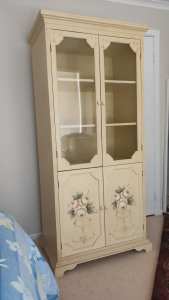 Decorated wooden cabinet with floral pattern 