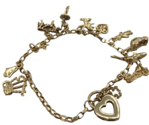 Lot 120 - A 9ct gold charm bracelet