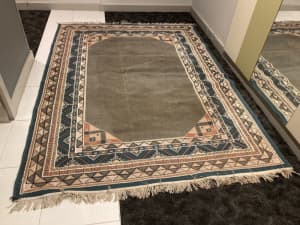 Medium rug Persian style brown colour for sale