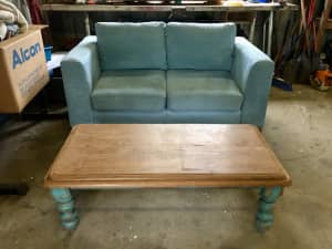 2 seater fabric lounge with metal legs and solid wood coffee table