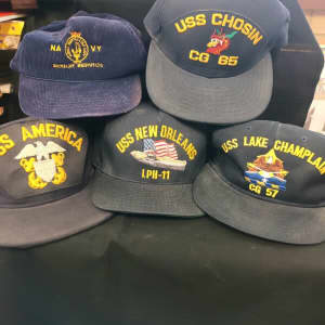 Assorted Navy themed collectable baseball caps