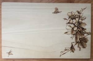 Pyrography on the paulownia with peony and butterfly pattern