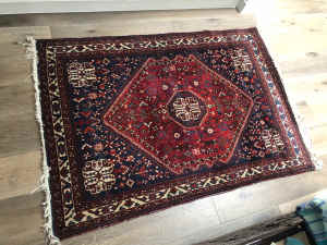 Persian rug with rich deep blue and red colours