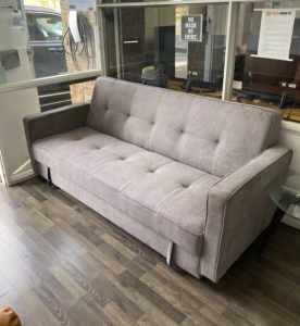 PRICE DROP FOR SAMPLE GREY JUNNY SOFA BED WITH EXTRA STORAGE!!