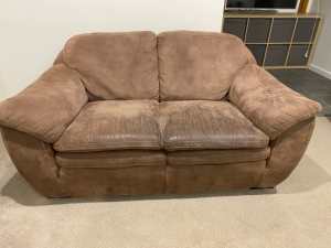 FREE: Brown 2 seater Lounge. About 8 years old