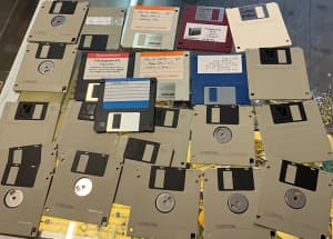 FLOPPY DISCS X 23 WITH EXTRA DISC PACKS AND CASE