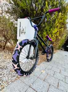 black and purple BMX bike