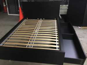 Black IKEA Malm queen bed frame with two drawers