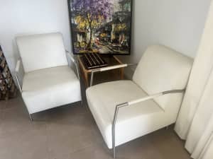 Two white leather armchairs