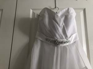 Wedding dress new and never worn size 10