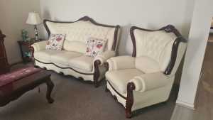 Immaculate leather lounge suite, 2 chairs, coffees tables, etc.
