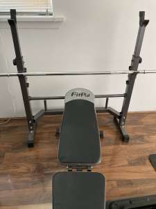 Bench press rack and barbell