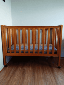 Wood frame baby cot with mattress