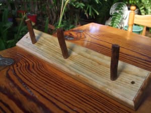 COAT/HAT RACK. New. Pine with wooden pegs. Great for the back door.
