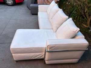 ! white leather L shape sofa with strong silver frame