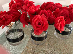 Vases with red roses