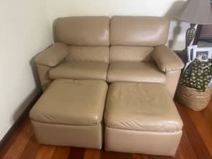 Two seat leather lounge and 2 ottoman’s