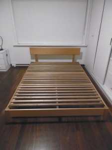 Queensize bed and base in good condition, solid wood base