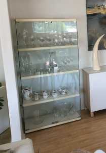 Glass cabinet. 4 white timber shelves. Available until Sunday 21st.