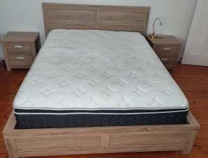 A full bedroom: queen bed, mattress, dresser, pair of bedside tables
